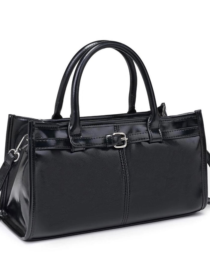 Black handbag with a buckle on a white background