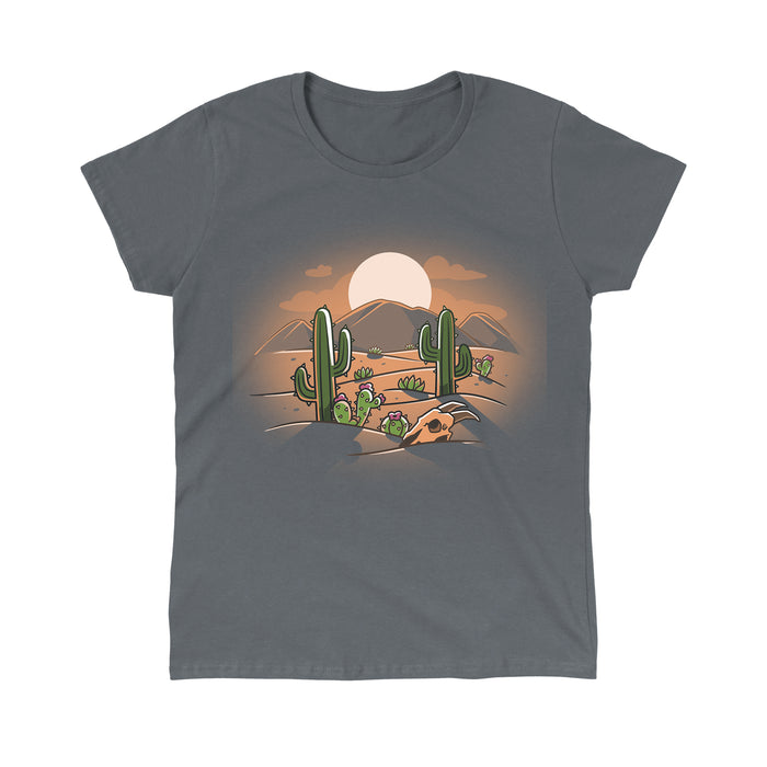 Classic Cotton T-shirt_TeeTurtle Desert at Dusk charcoal gray t-shirt featuring a cartoon desert scene with cacti, a cow skull, and distant mountains under a stunning desert sunset.