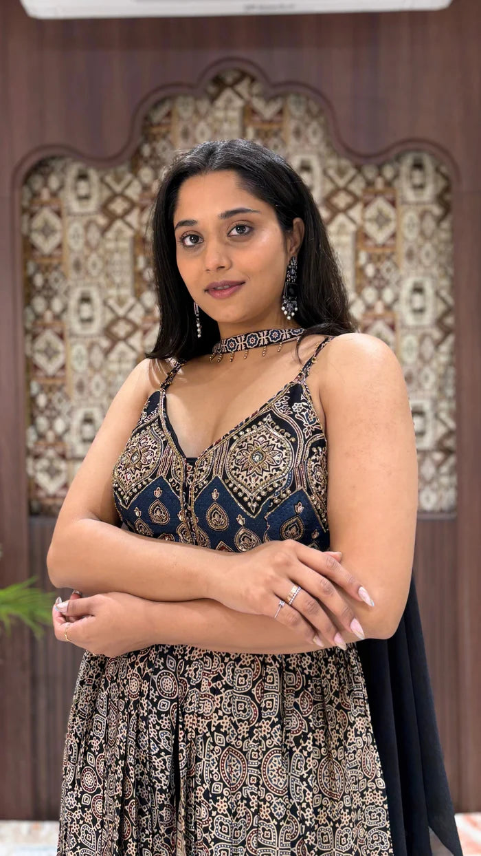 Elegant navy Ajrakh print Anarkali dress featuring spaghetti straps, intricate embroidery, and a matching fabric choker.