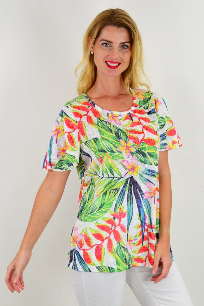 I Love Tunics Frangipani Floral Tunic Tee featuring vibrant floral pattern and comfortable casual fit, displayed on a plain background.