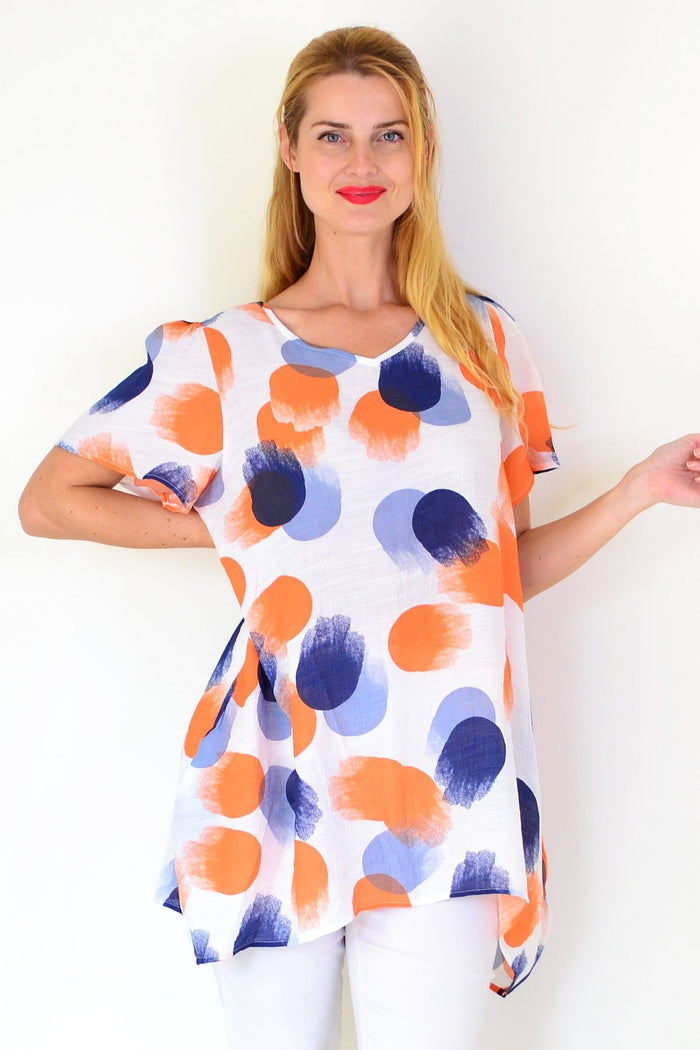 Orange and blue dotted summer tunic top by Wishstone, lightweight fabric with a relaxed fit and vibrant pattern.