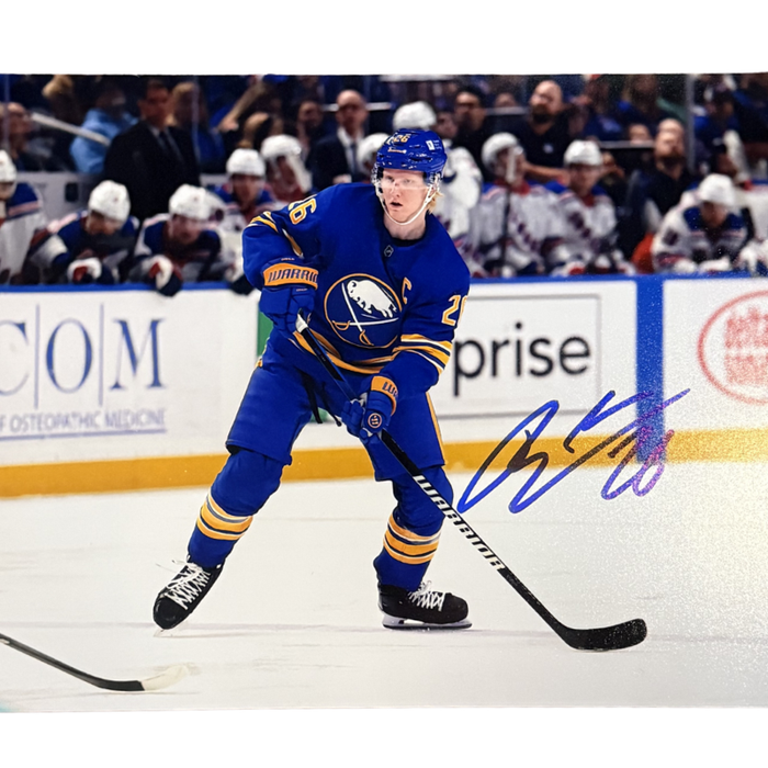 Rasmus Dahlin Signed Ready to Shoot Puck in all Blue Uniform Photo