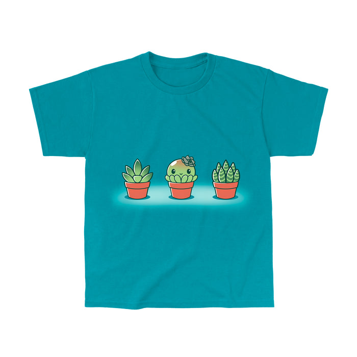 Classic Cotton T-shirt_TeeTurtle Succulent Surprise Tropical Blue apparel featuring a round kawaii & sweet succulent with a flower bow in the middle of two other succulents.