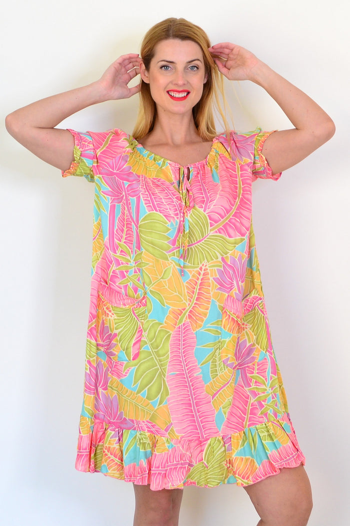 I Love Tunics Bahama Tunic Dress in lightweight fabric with a relaxed fit and tropical print, displayed on a hanger.