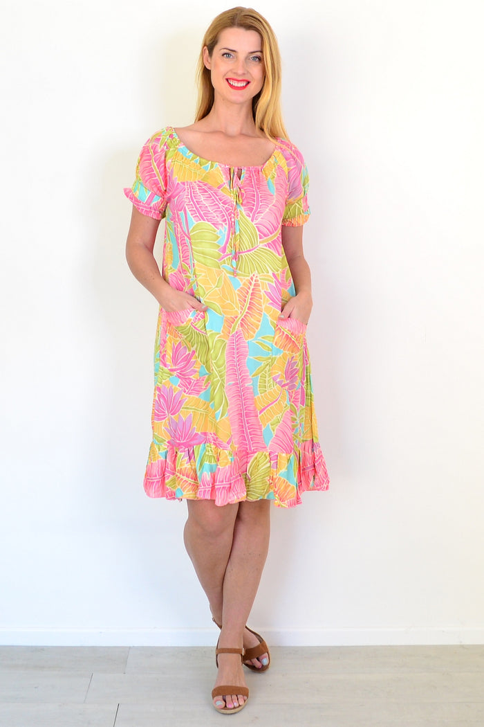 I Love Tunics Bahama Tunic Dress displayed on a hanger with a floral pattern and relaxed fit, perfect for casual summer wear.
