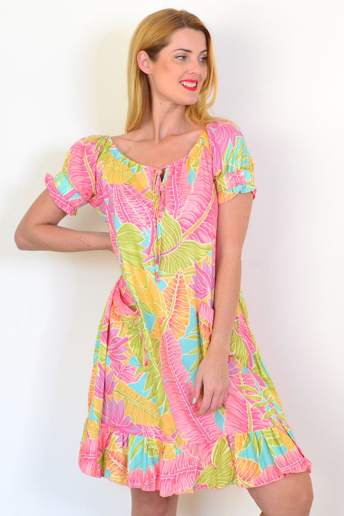 I Love Tunics Bahama Tunic Dress displayed on a hanger, lightweight fabric, relaxed fit, with tropical floral pattern.