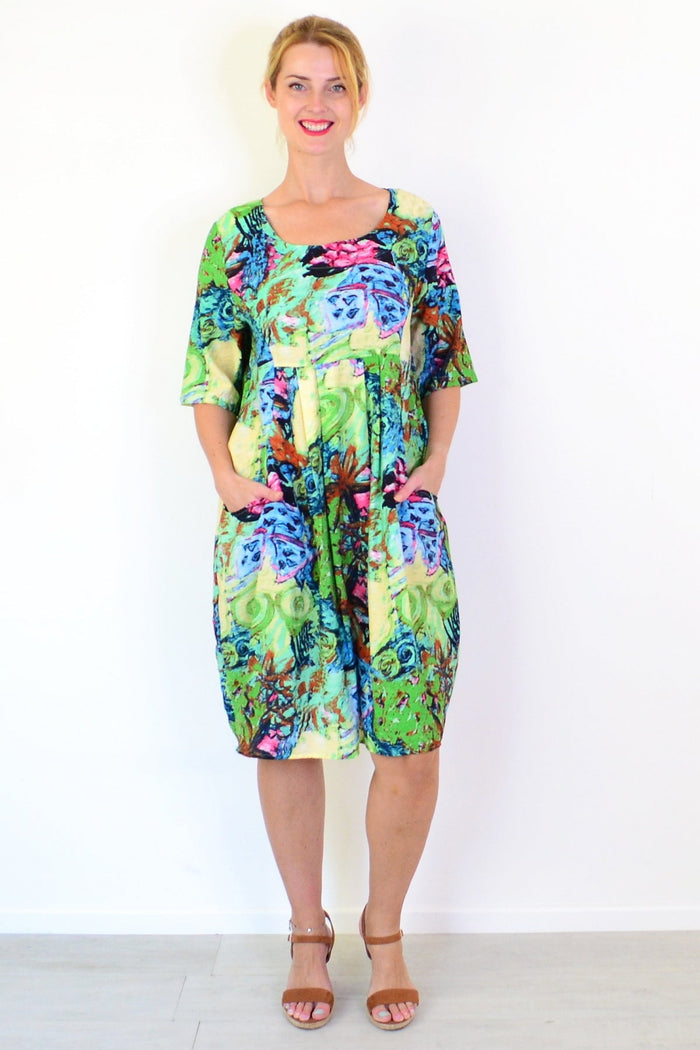 Ruby Rain Coastal Life summer tunic dress, lightweight and flowy with a relaxed fit and ocean-inspired print, displayed on a hanger.