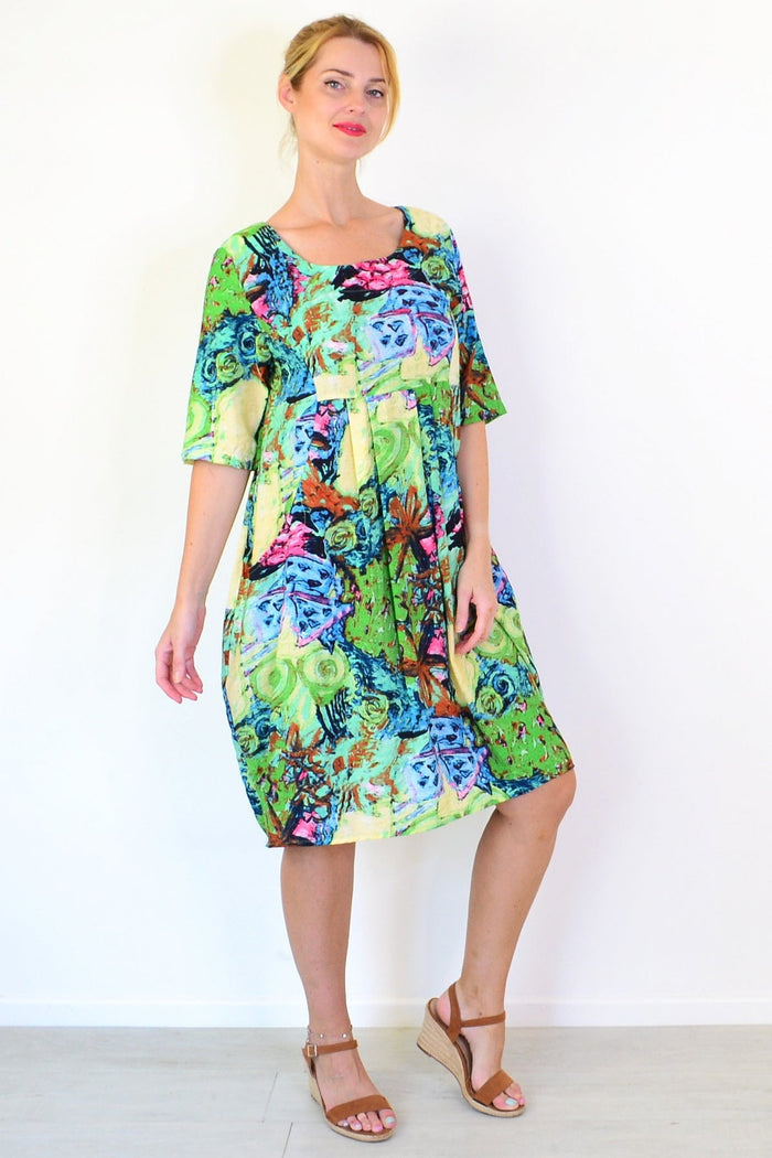 Ruby Rain Coastal Life summer tunic dress displayed on a hanger with a light, breezy fabric and coastal-inspired pattern.