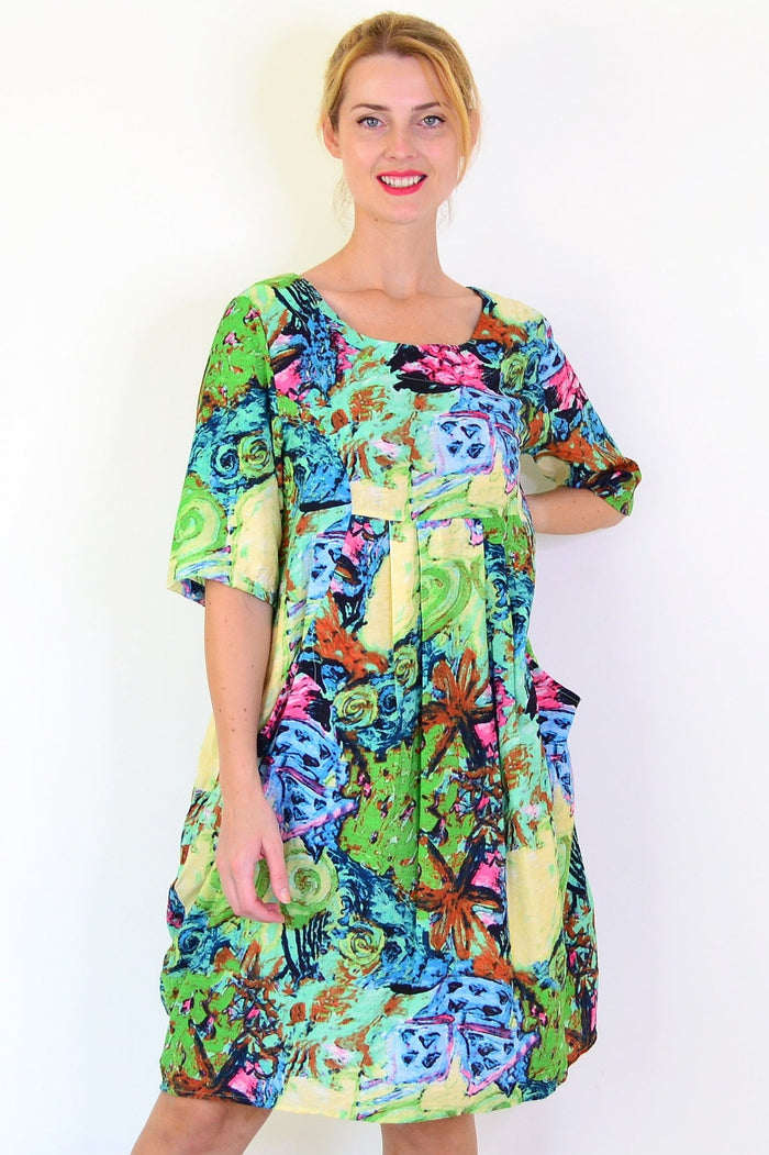 Ruby Rain Coastal Life summer tunic dress displayed on a hanger, featuring lightweight fabric and a relaxed, beach-inspired style.