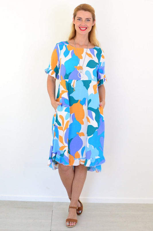 Colorful abstract summer dress tunic from New U Collection with vibrant patterns and flowing fabric, ideal for warm-weather wear.