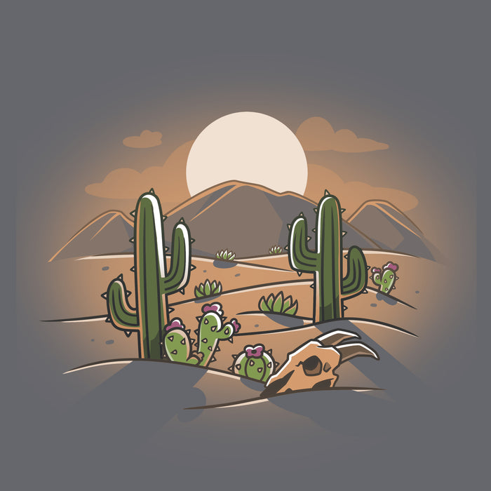Classic Cotton T-shirt_TeeTurtle  Desert at Dusk charcoal gray t-shirt featuring a cartoon desert scene with cacti, a cow skull, and distant mountains under a stunning desert sunset.