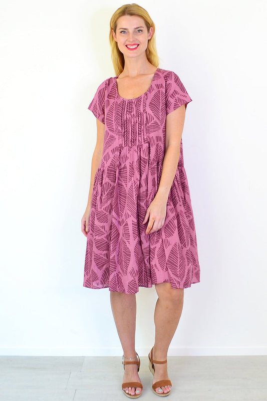 Dusty pink leaf print peasant tunic dress from Wishstone, featuring a relaxed fit and bohemian style, shown on a model.