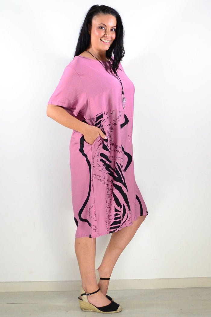 Dusty pink striped tunic dress by Sunshine featuring a relaxed fit and casual style, displayed on a hanger.