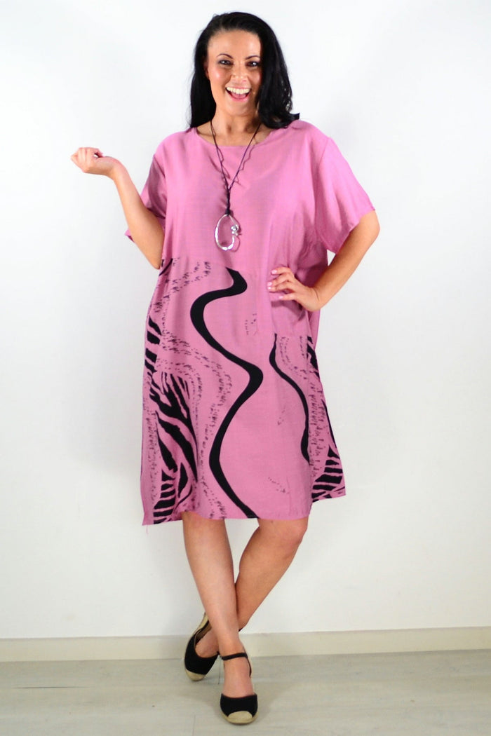 Dusty pink striped tunic dress by Sunshine, featuring long sleeves and a relaxed fit, displayed on a hanger.