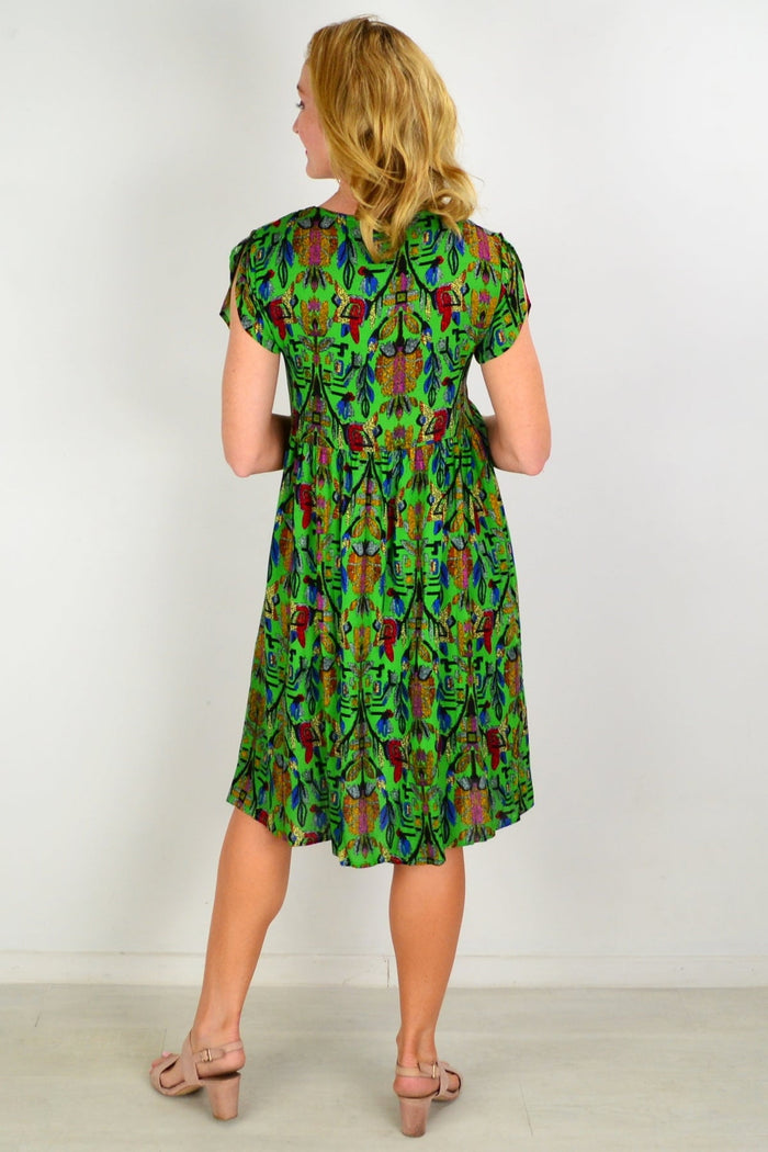 Hourglass gold leaf crossover sleeve shift dress tunic with elegant design, featuring gold accents and a relaxed fit.