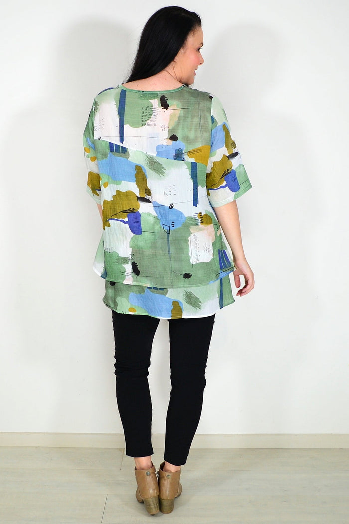 Green layered abstract tunic top from Whispers, featuring a flowy design with artistic patterns and relaxed fit.