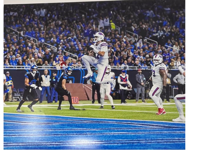 Josh Allen Unsigned Jumping Up in White Photo