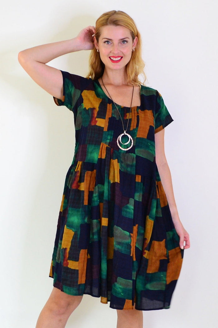 Wishstone mustard and olive abstract tunic dress, lightweight tunics with a colorful, artistic pattern, front view.