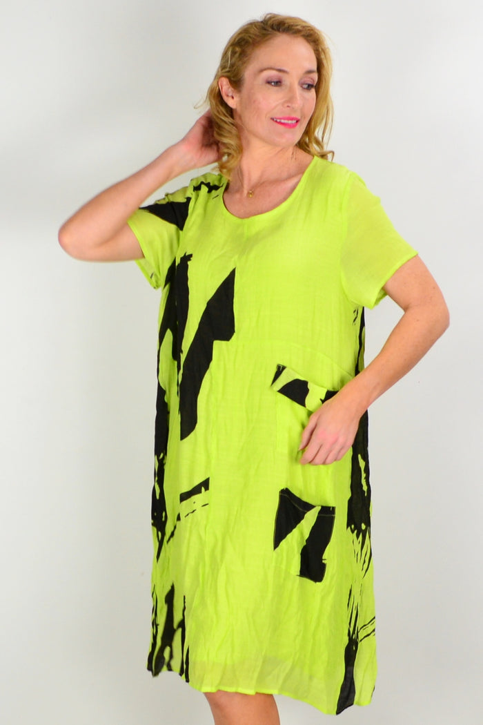 Wishstone Noosa Lime Tunic Dress, lightweight fabric with a relaxed fit, shown on a hanger against a neutral background.