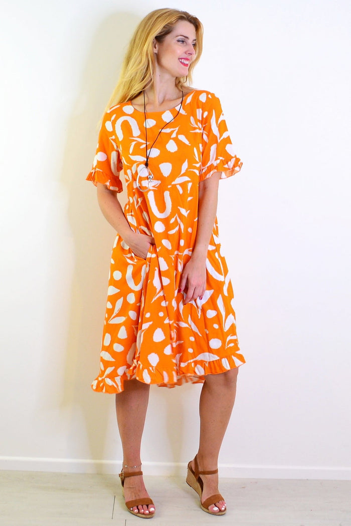 Orange and white spotted summer dress tunic from New U Collection, featuring a lightweight, breathable fabric with a stylish print.