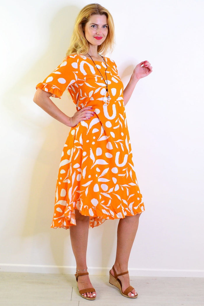Orange and white spotted summer dress tunic from New U Collection, featuring a vibrant print and lightweight fabric.
