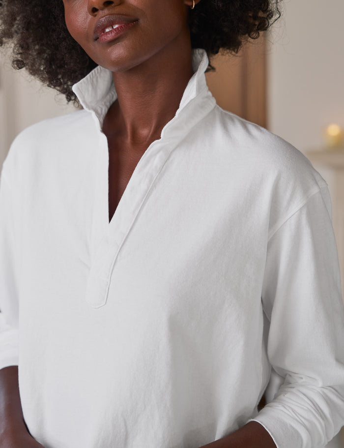 Woman wearing a white shirt with a blurred background