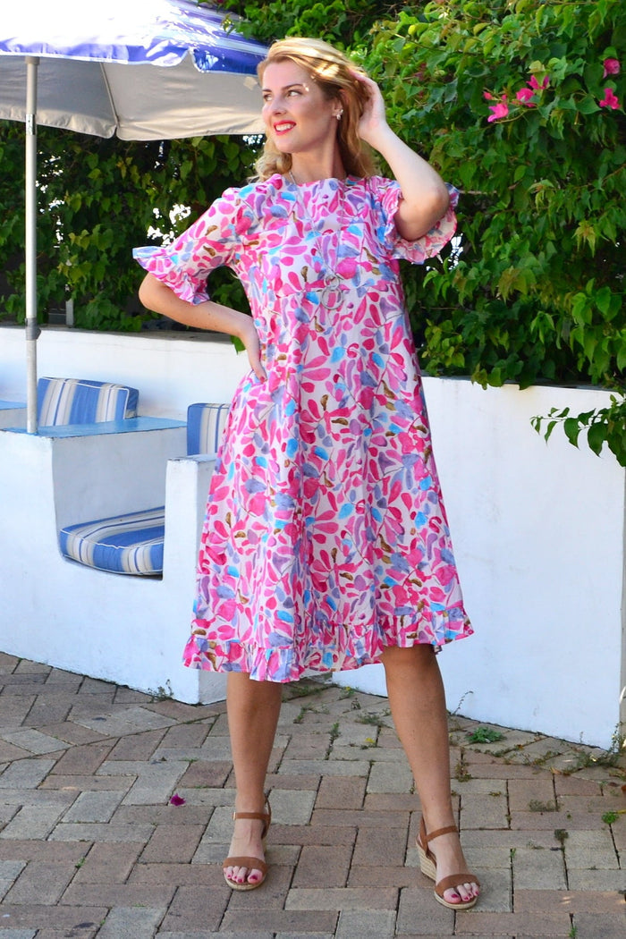 Pink and blue leaves print summer tunic dress by Hourglass featuring lightweight fabric and vibrant botanical design.