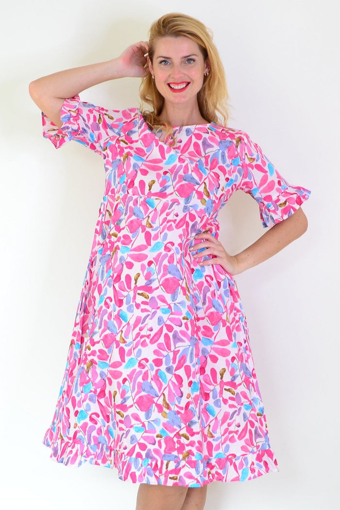 Pink and blue leaves print Summer Dress tunic by Hourglass with flowy fabric and vibrant botanical pattern.