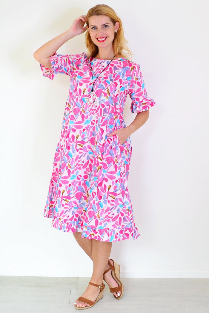 Pink and blue leaves print summer tunic dress by Hourglass, lightweight fabric with floral pattern and relaxed fit.