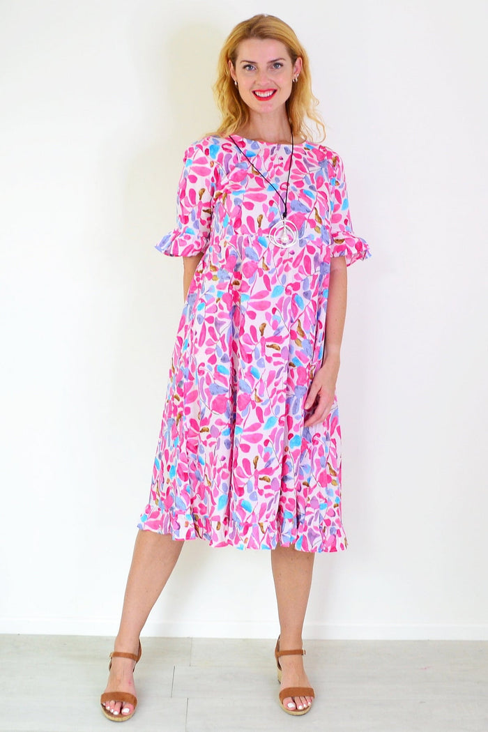Pink and blue leaves print Hourglass summer dress tunic with a flowy design, ideal for warm weather and casual wear.