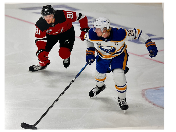 Rasmus Dahlin Unsigned with Puck vs New Jersey Photo