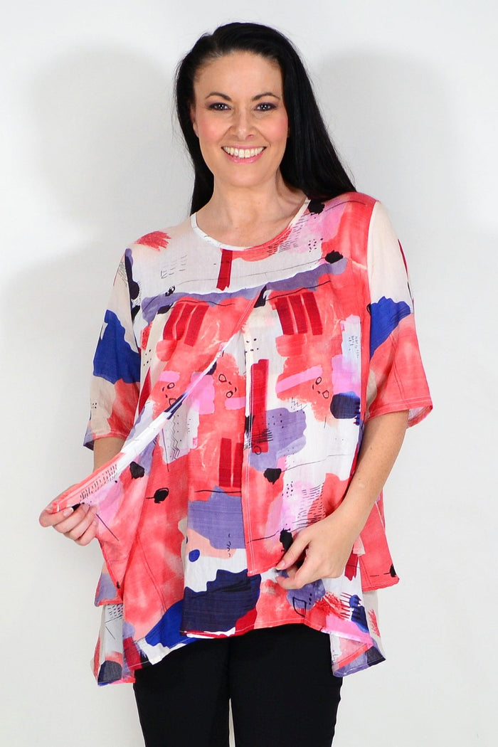 Red layered abstract tunic top by Whispers featuring flowing fabric and artistic design, styled for a casual or boho look.