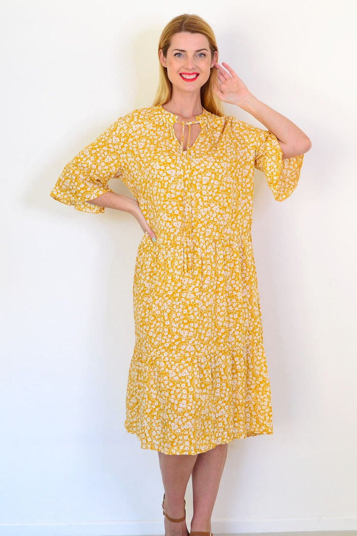 Peony summer field tunic dress with floral pattern, lightweight fabric, and relaxed fit, shown on a model.