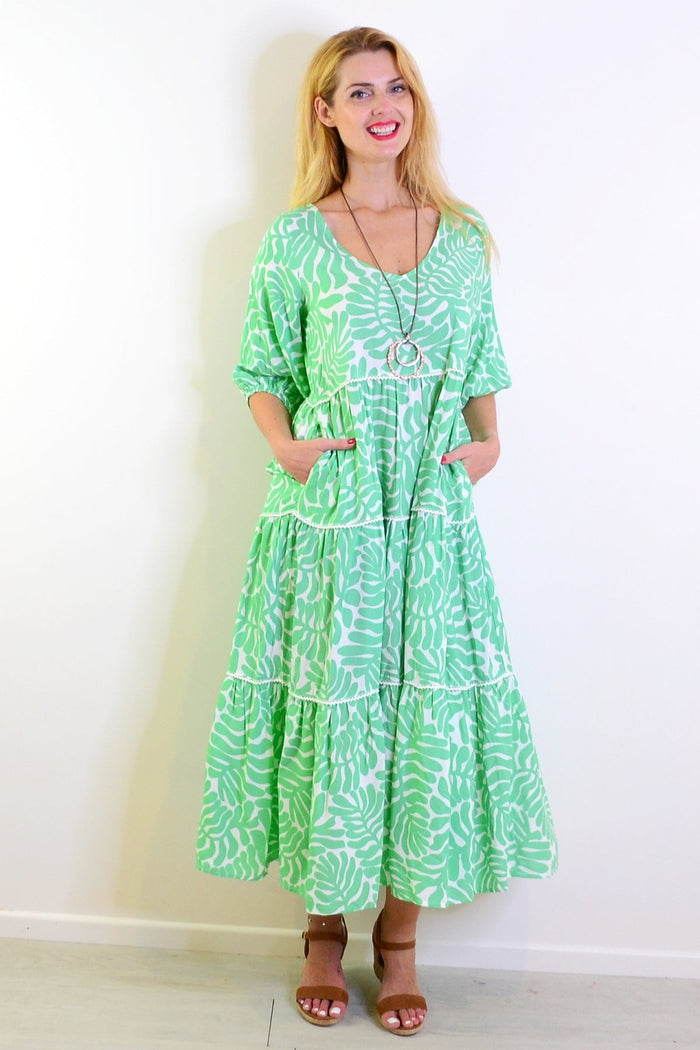 White and green tiered tunic dress from New U Collection, featuring flowy fabric and layered design perfect for casual wear.