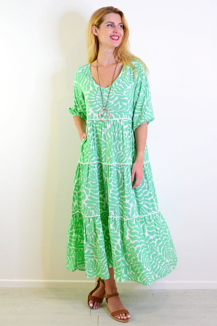White and green tiered tunic dress from New U Collection, featuring a flowing, layered design perfect for casual wear.