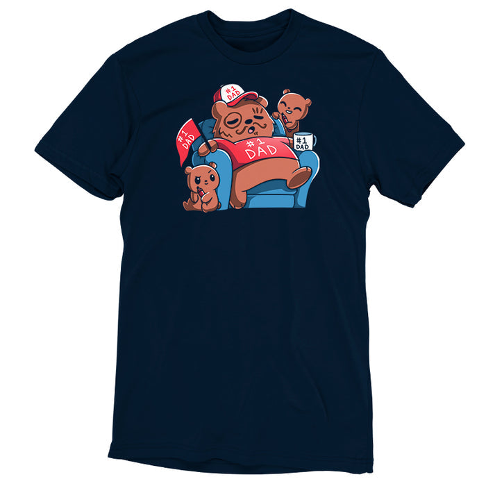 Premium Cotton T-shirt_TeeTurtle navy blue World's Greatest Dad apparel featuring a sleeping father grizzly bear on a blue recliner with a #1 Dad shirt, flag, mug, and hat with marker doodles on his face, and two cubs holding markers and snickering mischievously.